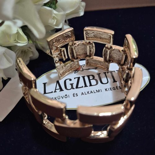 Barna, széles fémkarkötő.