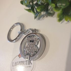   Kulcstartó, rozsdamentes acélból, forgatható, strasszos macival.